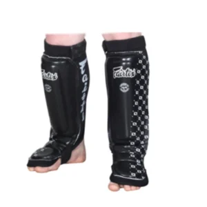 A pair of black and white shin guards.