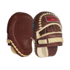 A pair of brown and white pads for boxing.