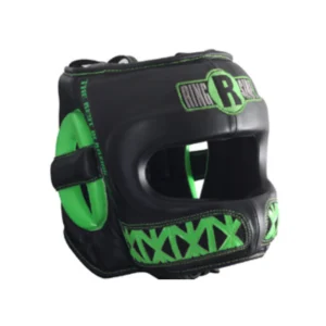 A black and green helmet is on the ground