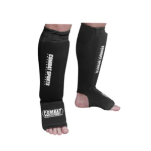 A pair of black shin guards on the feet.