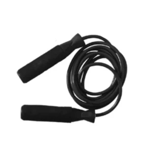 A black jump rope is laying on the ground.